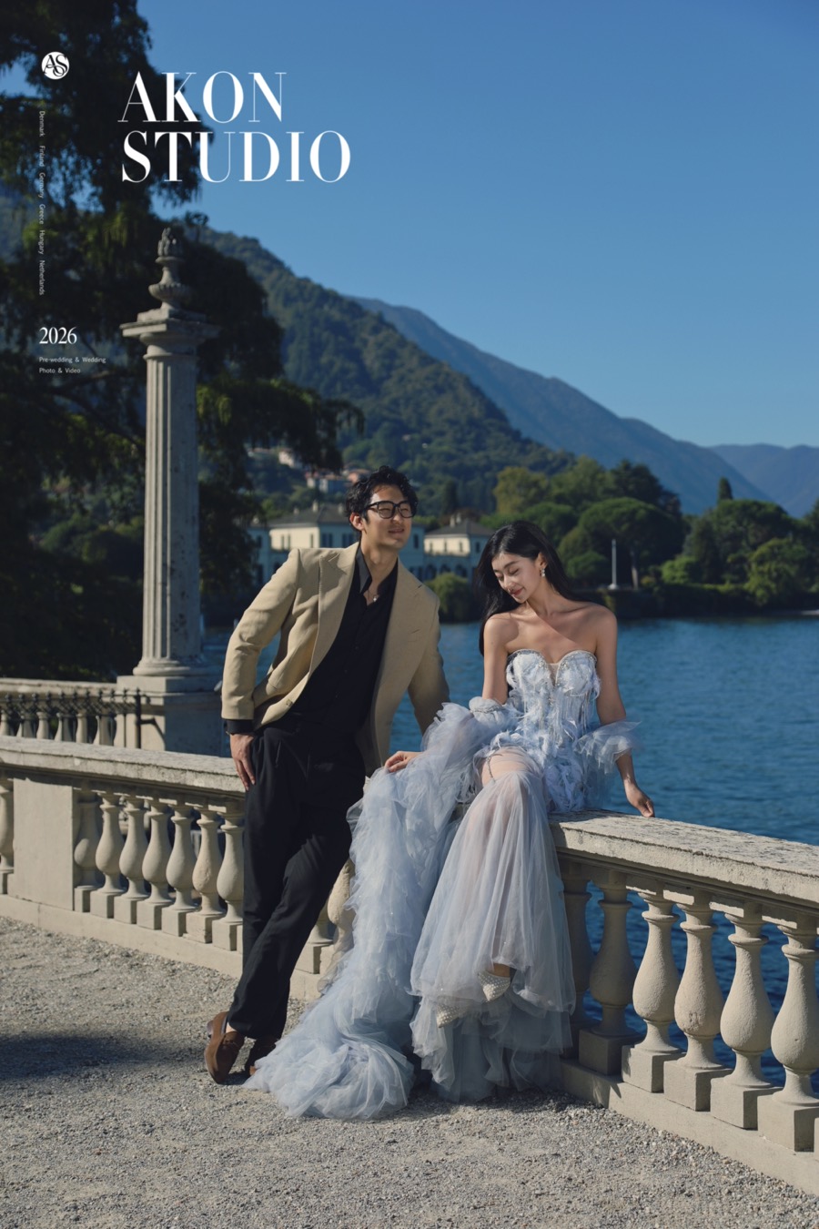 Couple at a villa balustrade overlooking Lake Como — Akonstudio pre-wedding photoshoot